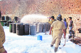 Fire-fighters douse a fire at a chemical unit in Ludhiana on Friday. 
