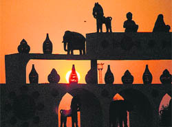 The setting sun creates a beautiful silhouette pattern at the Kalagram entrance in Chandigarh.