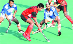 Players of Namdhari XI and PSB in action at the Hockey Stadium, Sector 42, in Chandigarh on Saturday.