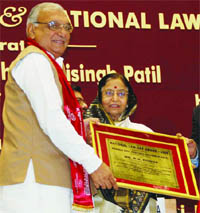President Pratibha Patil presents the National Law Day Award-2009 to Haryana Chief Minister Bhupinder Singh Hooda for his contribution in ensuring effective legal administration in the state at Vigyan Bhavan in New Delhi on Saturday.