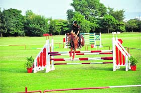 Another rider negotiates a hurdle during the selection trials for the XVI Asian Games held at 61 Cavalry in Jaipur