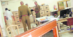 Cops inspect the Union Bank branch in Kaithal on Saturday.