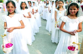 Girls from a Christian school participate in a special prayer on the golden jubilee celebrations of the Archdiocese of Delhi (1959- 2009) at the Cathedral of Sacred Heart Catholic Church in New Delhi on Sunday.