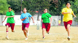 Students participate in the race at Doon International School during its annual sports day in Dehradun on Sunday