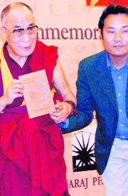 Tibetan spiritual leader Dalai Lama releases a book on Tibet at the Hind Swaraj Centenary Commemoration International Conference in Faridabad on Sunday.