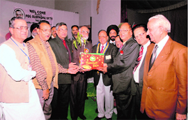 Regional director Rtn YP Das being honored by members of the Rotary Club at Guru Nanak National College, Doraha.