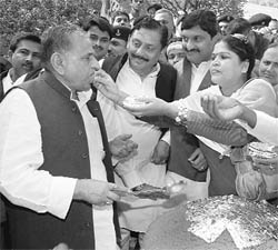 Samajwadi Party workers offer sweets to party chief Mulayam Singh Yadav on his 71st birthday in Lucknow on Sunday.