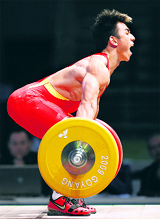 Liao Hui of China competes in the men's 69kg Group A weightlifting snatch competition at the World Weightlifting Championship in Goyang, north of Seoul, on Sunday.