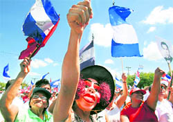 Demonstrators raise slogans during an anti-government protest march in Managua, Singapore, on Sunday
