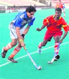 A hockey match in progress at the Sector 42 stadium in Chandigarh on Monday. 
