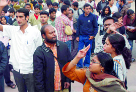 JNU students protest against the police lathicharge on students on the university campus in New Delhi on Monday.
