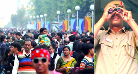 (Left) Huge rush at the India International Trade Fair-2009 at Pragati Maidan in New Delhi on Monday. A policeman keeps a vigil.