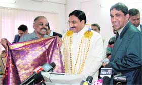 The CM being conferred DLit honorary degree by officials of International Open University, Colombo, in Dehradun