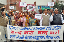 Residents of Sector-10 demand shifting of factories to some other place in Gurgaon on Monday.
