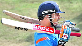 Virender Sehwag waits to bat in the nets at Kanpur on Monday.