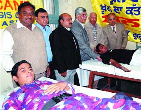 People donate blood in a camp at DAV College in Amritsar.