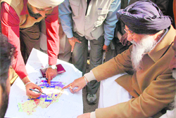 District Town Planner Gurpreet Singh and Punjab Chief Minister Parkash Singh Badal at the proposed location of the memorial at Chhapar Chiri.