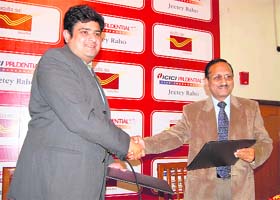 Faiz-ur-Rehman (right), Uttarakhand Post Master General, with Anup Rau, Vice-President, ICICI Prudential, at the launch of joint services in Dehradun