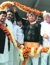 Chief Parliamentary Secretary Dharmbir Singh being felicitated at Kirorimal Park in Bhiwani on Tuesday.  