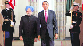 Prime Minister Manmohan Singh and President Barack Obama arrive for the state ceremony at the White House in Washington on Tuesday.