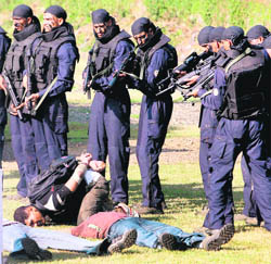 Personnel of Force One display their skills at their headquarters in Mumbai on Tuesday.