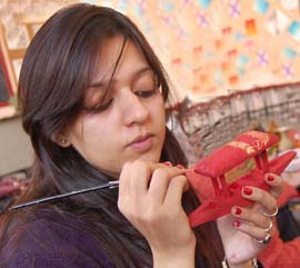 Apeejay college student gives finishing touches to an art piece. 