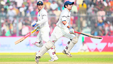 Virender Sehwag (left) and Gautam Gambhir run between the wickets at the Green Park stadium in Kanpur on Tuesday.