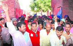 Residents gherao the police station in protest against the burning of vehicles at Mauli Jagran in Chandigarh on Wednesday.