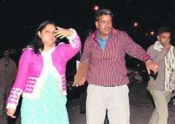 An employee of the victim being taken to his office.