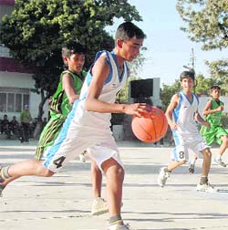 A match in progress at the Junior Council Boys Basketball Tournament in Dehradun on Wednesday.