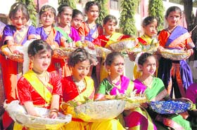 Students of Kendriya Vidyalaya, OFD, wait to greet the chief guest at the annual sports day in Dehradun on Wednesday.