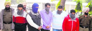 The five arrested swindlers in Mandi Gobindgarh on Wednesday.