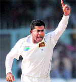 Sri Lankas Ranagana Herath celebrates the wicket of Rahul Dravid in Kanpur on Wednesday