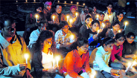 Students and members of the faculty of the Government College of Arts, Sector 10, remember those who had lost their lives to terror.