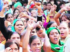 Protesters from 18 states take part in an agitation, asking the UPA government to fulfil its promises on food security, in New Delhi on Thursday.