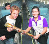 British Formula One driver Jenson Button (left) holds the Queens Baton for the 2010 Delhi Games on its way from Guernsey to Gibraltar