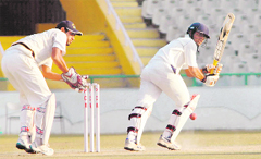 Gujarats Rujul Bhattplays a shot 