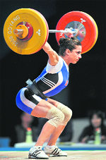 Sibel Simsek of Turkey attempts a lift during the womens 63kg category event at the World Weightlifting Championships in Goyang, north of Seoul,
