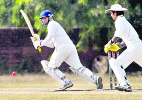 A player from SD College hits a shot against Government College, Ludhiana, during the Inter-College Cricket Tournament in Chandigarh