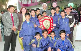 The Hilton School team poses with the trophy after winning the Council School Junior Basketball Championship in Dehradun