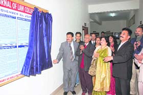 Jitendra Joshi, Chairman, Law College, Dehradun, inaugurates the first wall journal of the college at Premnagar near Dehradun