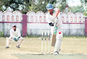 A batsman plays a shot at the Shyam Dutt Joshi Memorial Cricket Tournament in Dehradun