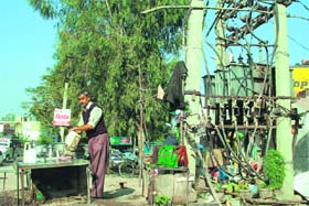 A low-lying power transformer along the national highway in Satwari