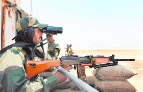  BSF jawans keep vigil at Kotri Dharamshala border outpost in the Rann Of Kutch on Friday