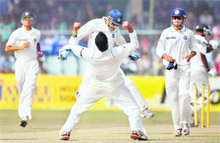 Harbhajan Singh (C) reacts after taking the wicket of Prasanna Jayawardene in Kanpur on Friday. India beat Sri Lanka by an innings and 144 runs. 