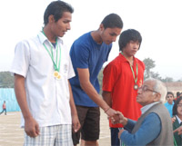 Chairman of the DPS Society Ashok Chandra congratulates a winner at the DPS annual athletic meet in Bathinda on Saturday.