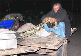 An old man protects himself with a blanket with the dip in mercury.