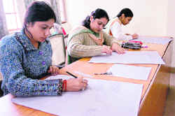Students take part in the sketching competition during the Display Your Talent contest at Jammu University on Saturday.