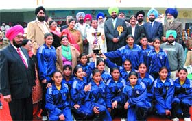 A Punjab team poses with their trophy with Technical Education Minister Swarna Ram and Amritsar MP Navjot Singh Sidhu at the concluding ceremony of the 55 National School Games in Jalandhar