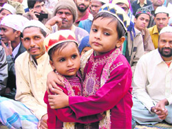 Children greet each other on Id-ul-Zuha in Ludhiana on Saturday. 